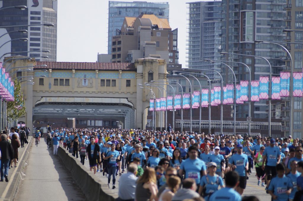 The peak time of runners along the Burrard Street Bridge. If you look down the left bike lane, you can also see me near the bridge. Photo credit: Michael Whyte
